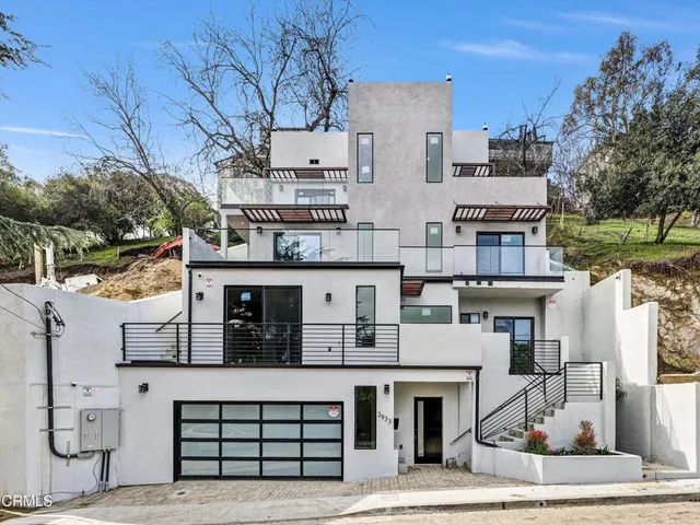 a view of a white building among the street