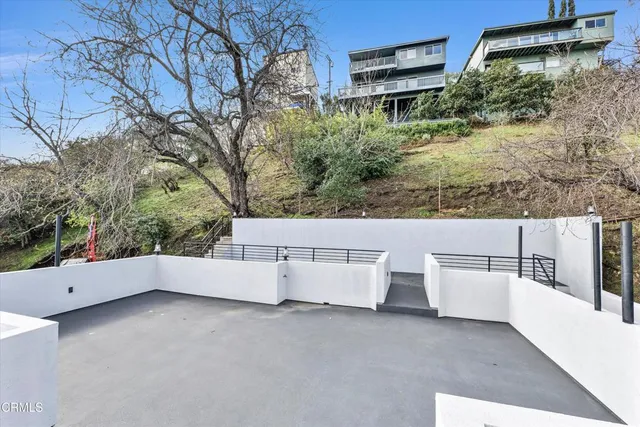 a view of a city that has tall trees