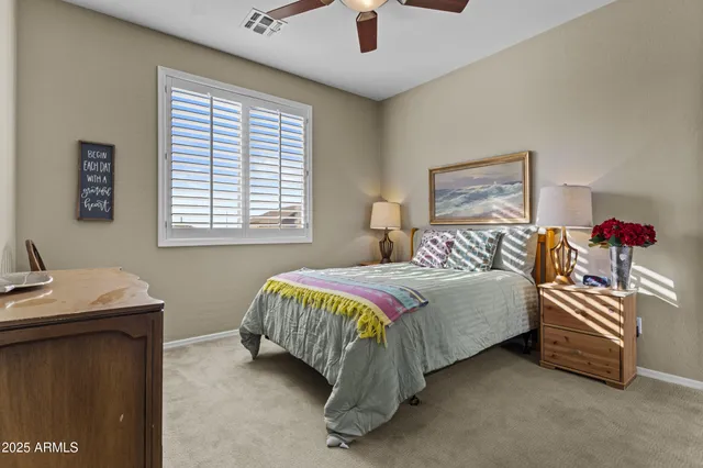 a bedroom with a bed and a desk