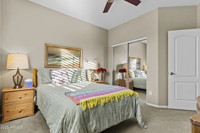 a bedroom with a bed and a dresser in it