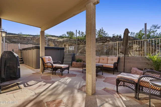 a view of balcony with couch and chairs