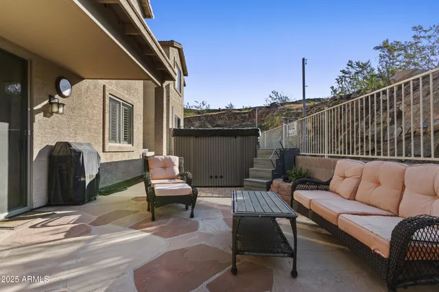 a view of a patio with couches and a table