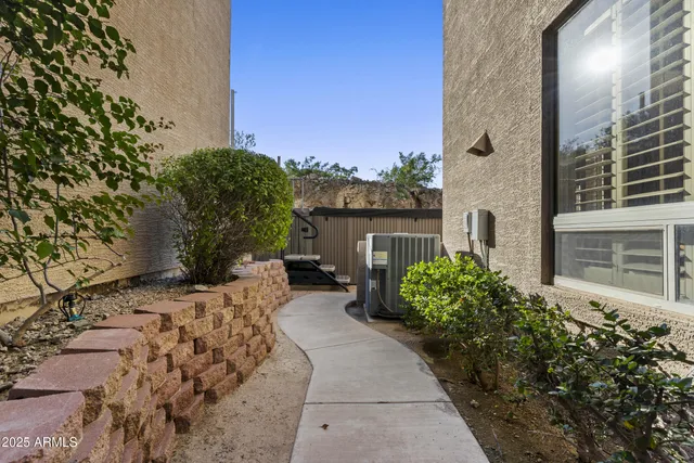 a view of a house with a yard and tree s
