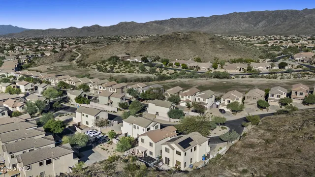 an aerial view of house with yard