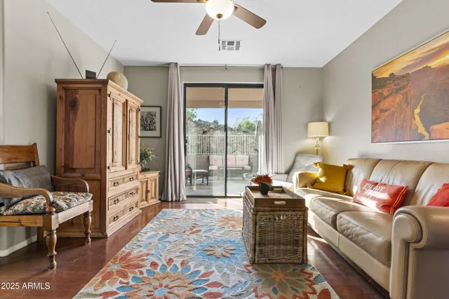 a living room with furniture fireplace and flat screen tv