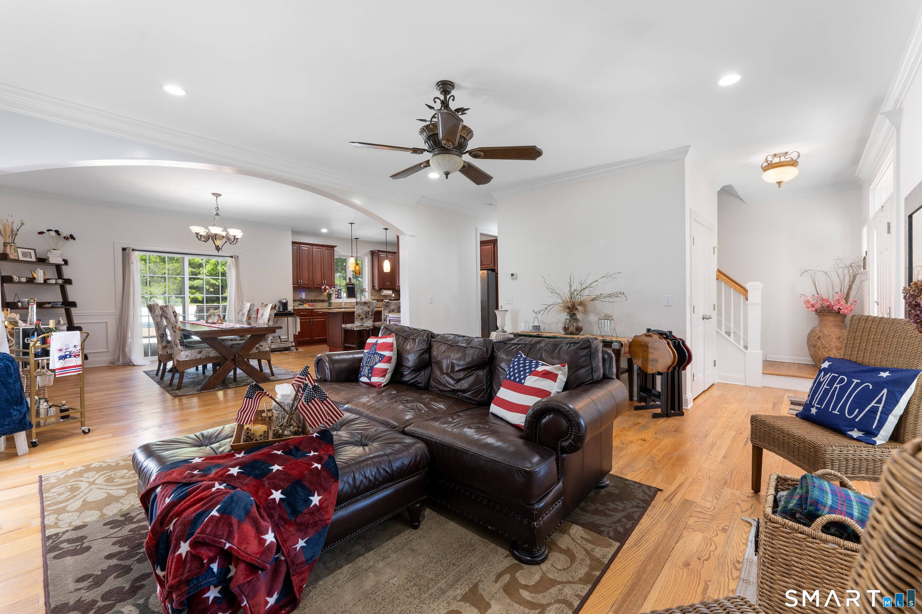 261 Spring Road North Haven, CT 06473 - Photo 11 of 39 a living room with furniture a chandelier and a couch