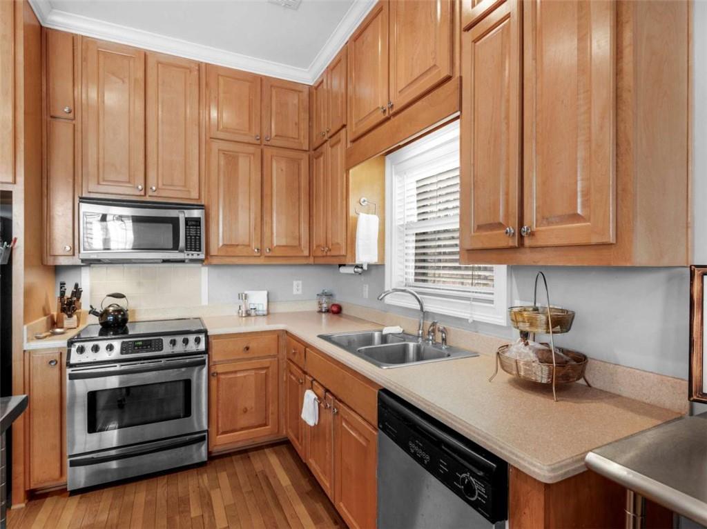 157 Andrea Circle Jackson, GA 30233 - Photo 3 of 19 a kitchen with stainless steel appliances a stove a sink and cabinets
