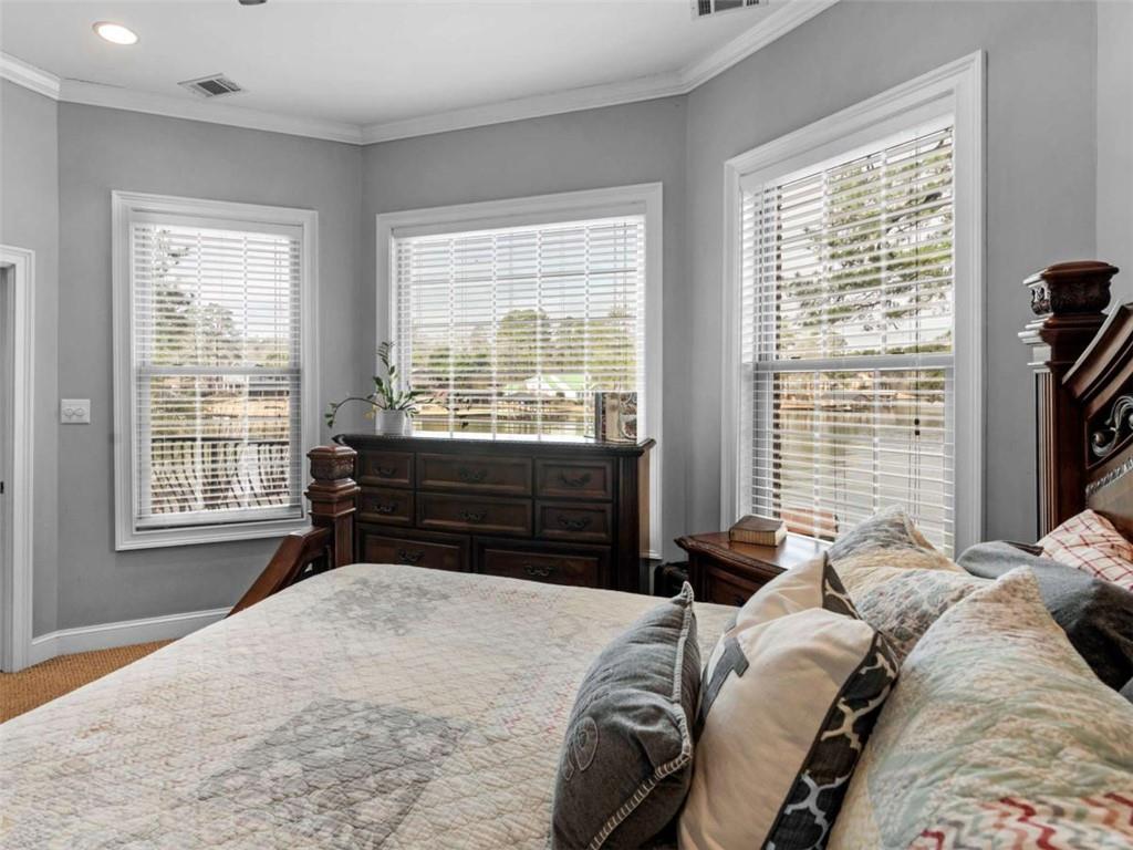 157 Andrea Circle Jackson, GA 30233 - Photo 7 of 19 a bedroom with a bed and a large window
