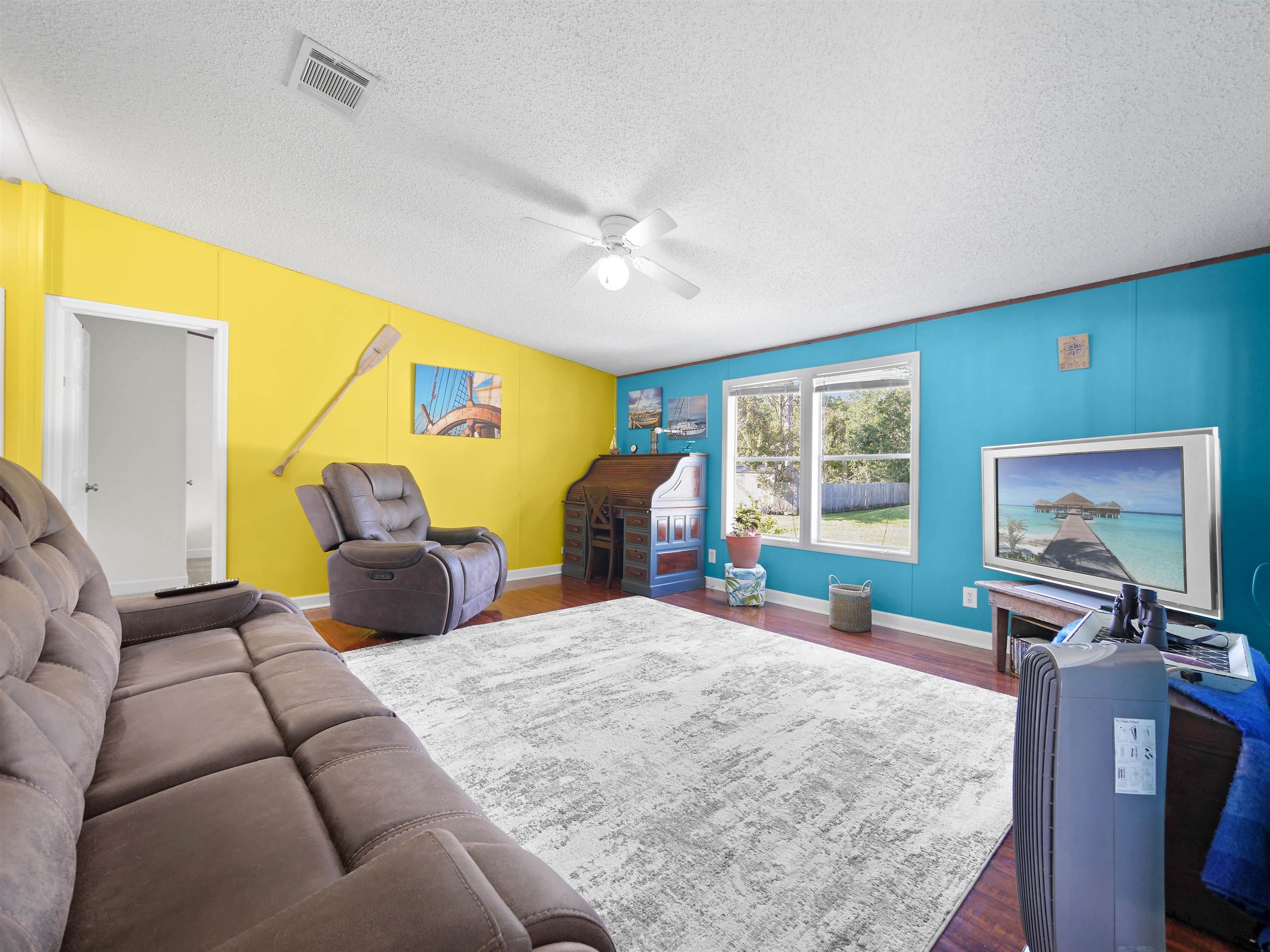 2961 Race Track Road St. Augustine, FL 32084 - Photo 28 of 42 a bedroom with a bed window and a flat screen tv