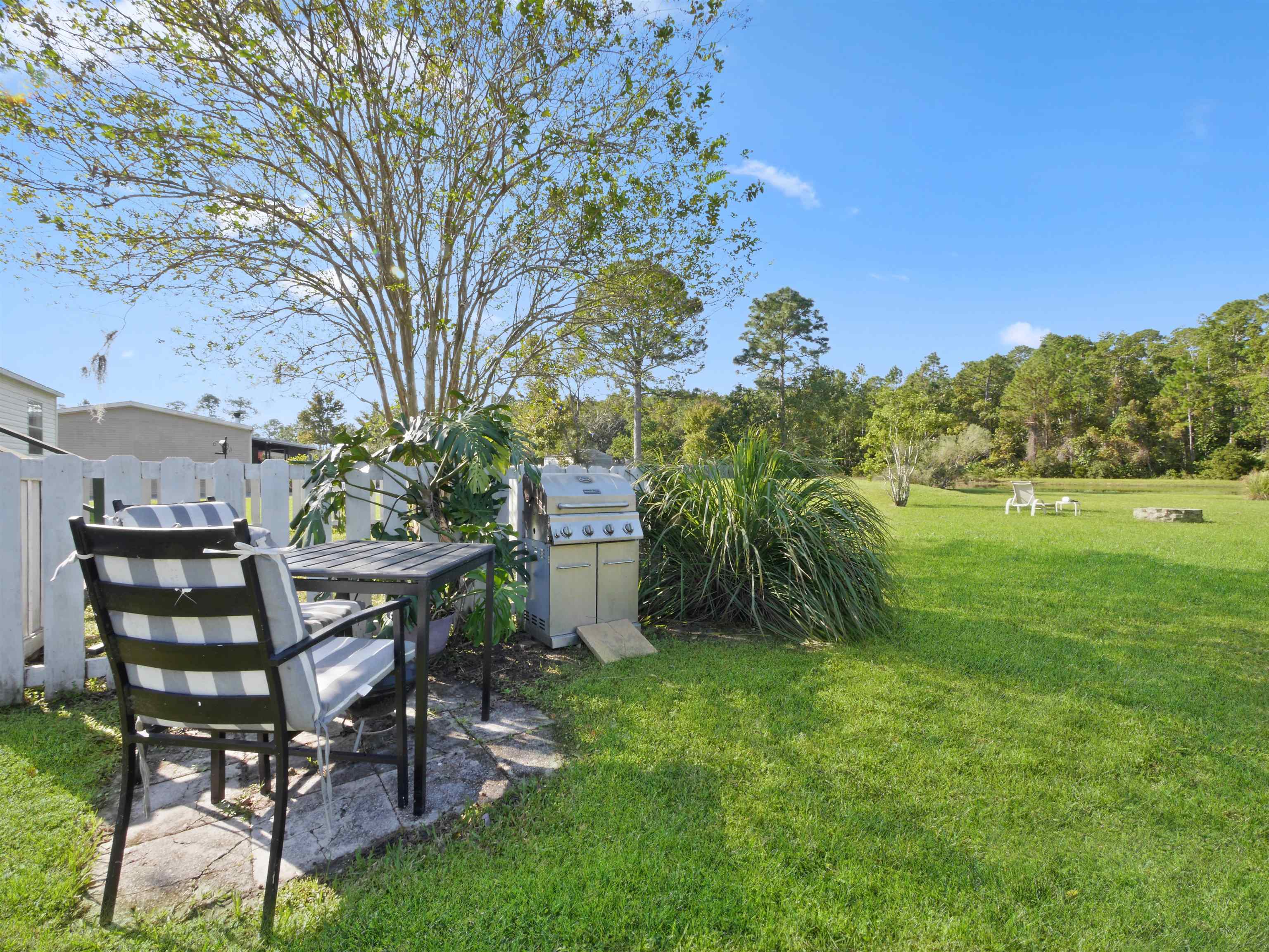 2961 Race Track Road St. Augustine, FL 32084 - Photo 32 of 42 a view of a chairs and table in the garden