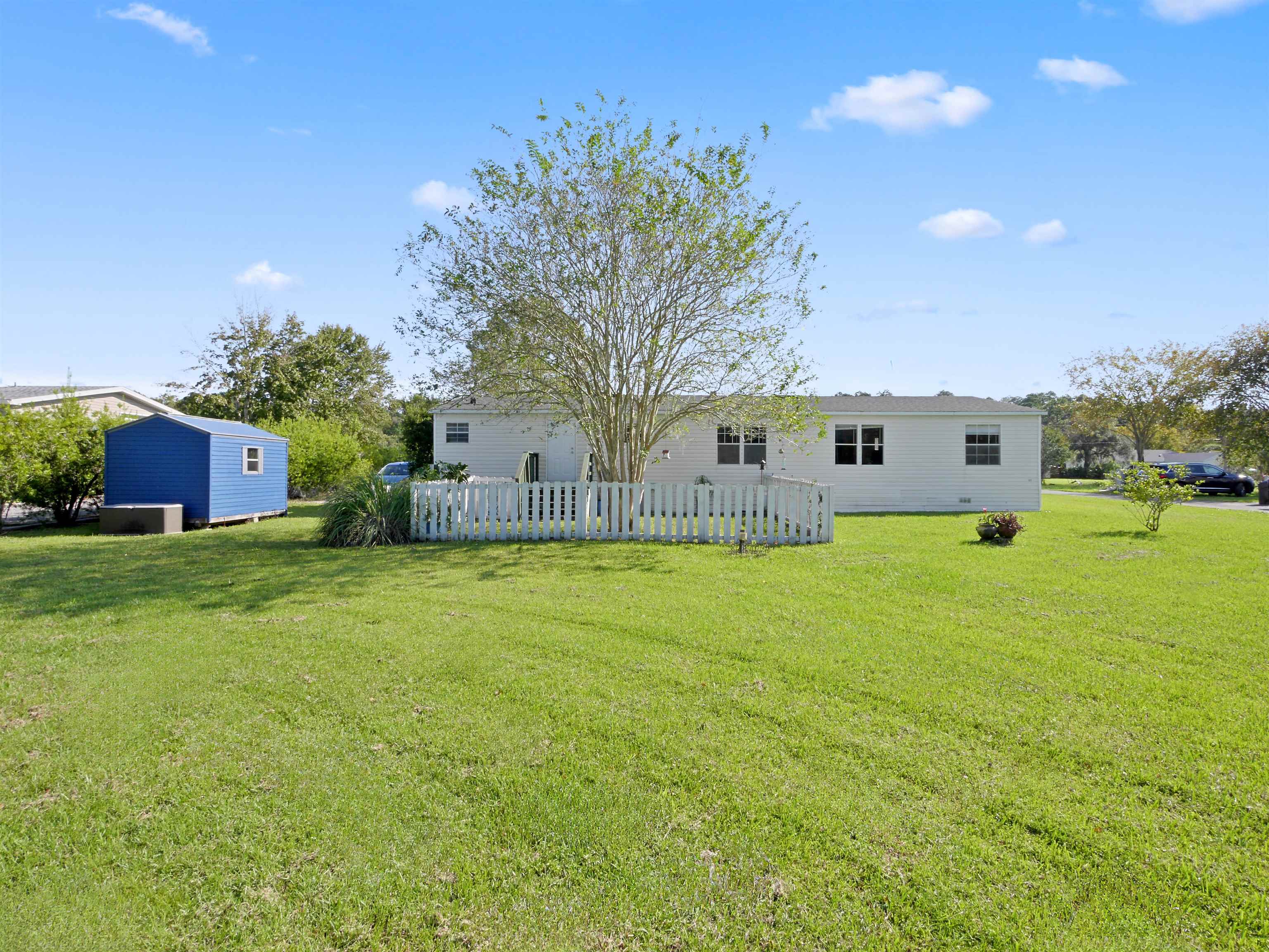 2961 Race Track Road St. Augustine, FL 32084 - Photo 35 of 42 a front view of house with yard and trees