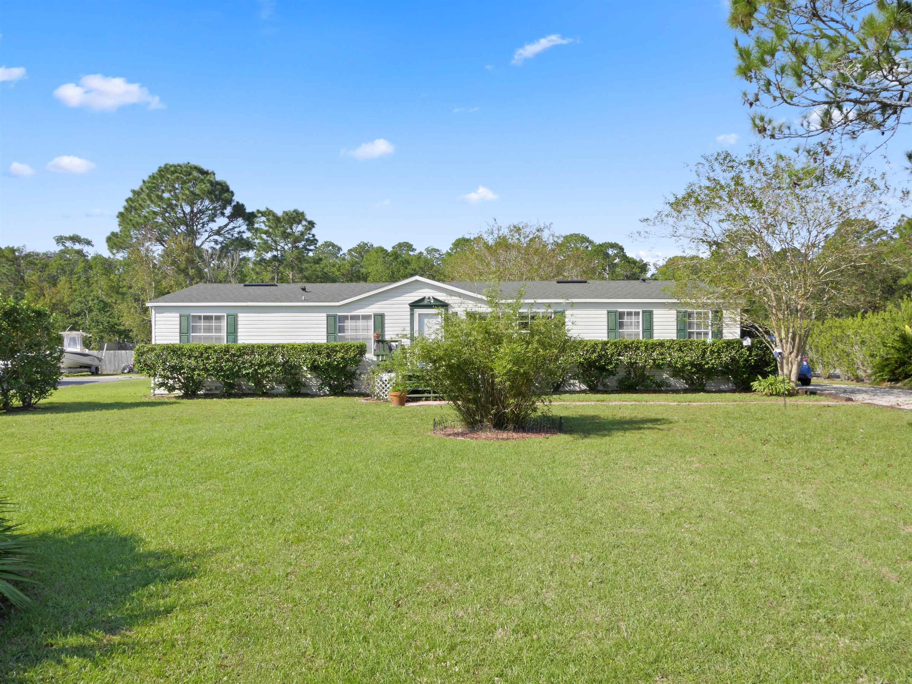2961 Race Track Road St. Augustine, FL 32084 - Photo 38 of 42 a front view of a house with a yard