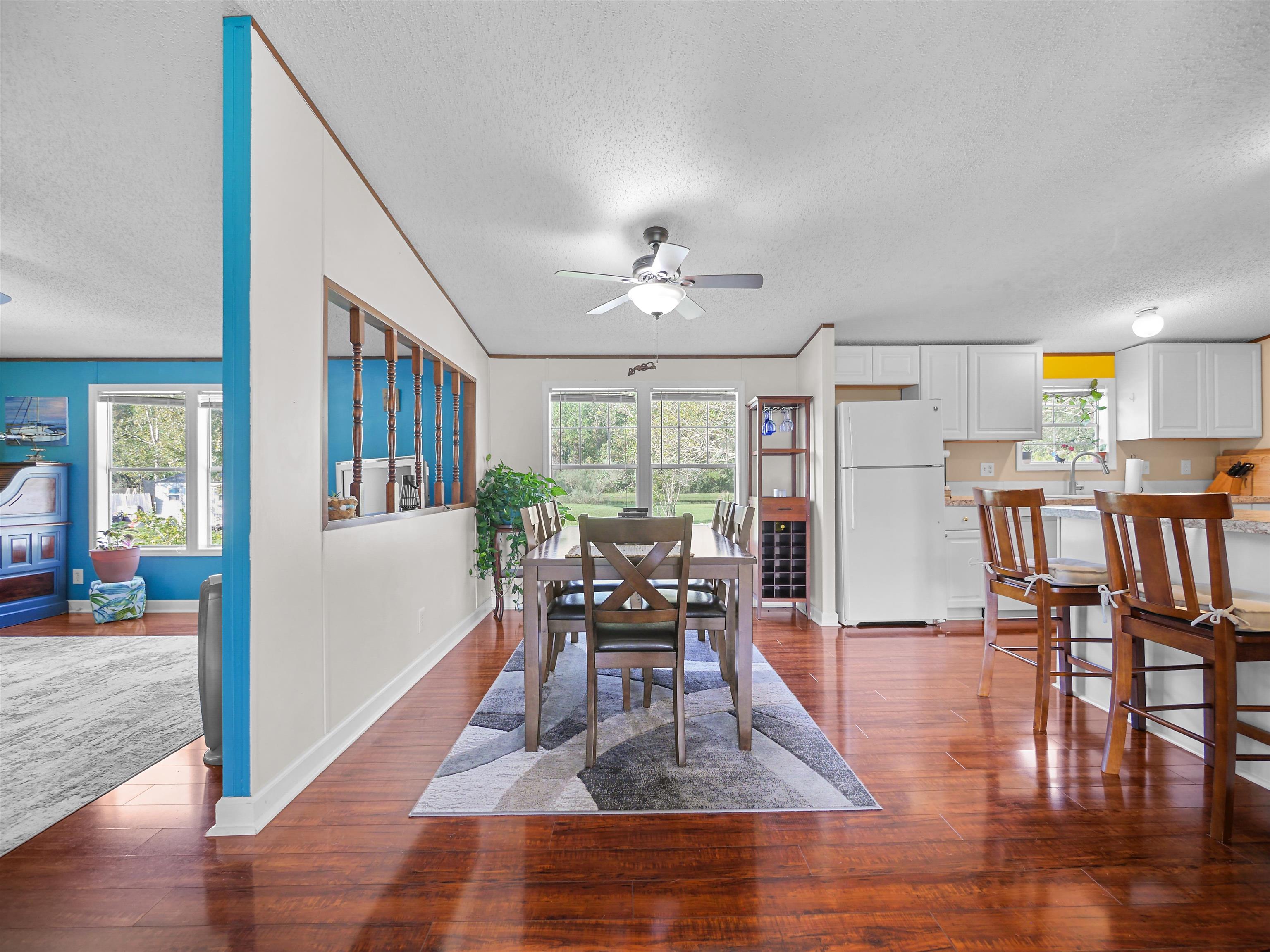 2961 Race Track Road St. Augustine, FL 32084 - Photo 7 of 42 a living room with furniture dining table and a large window