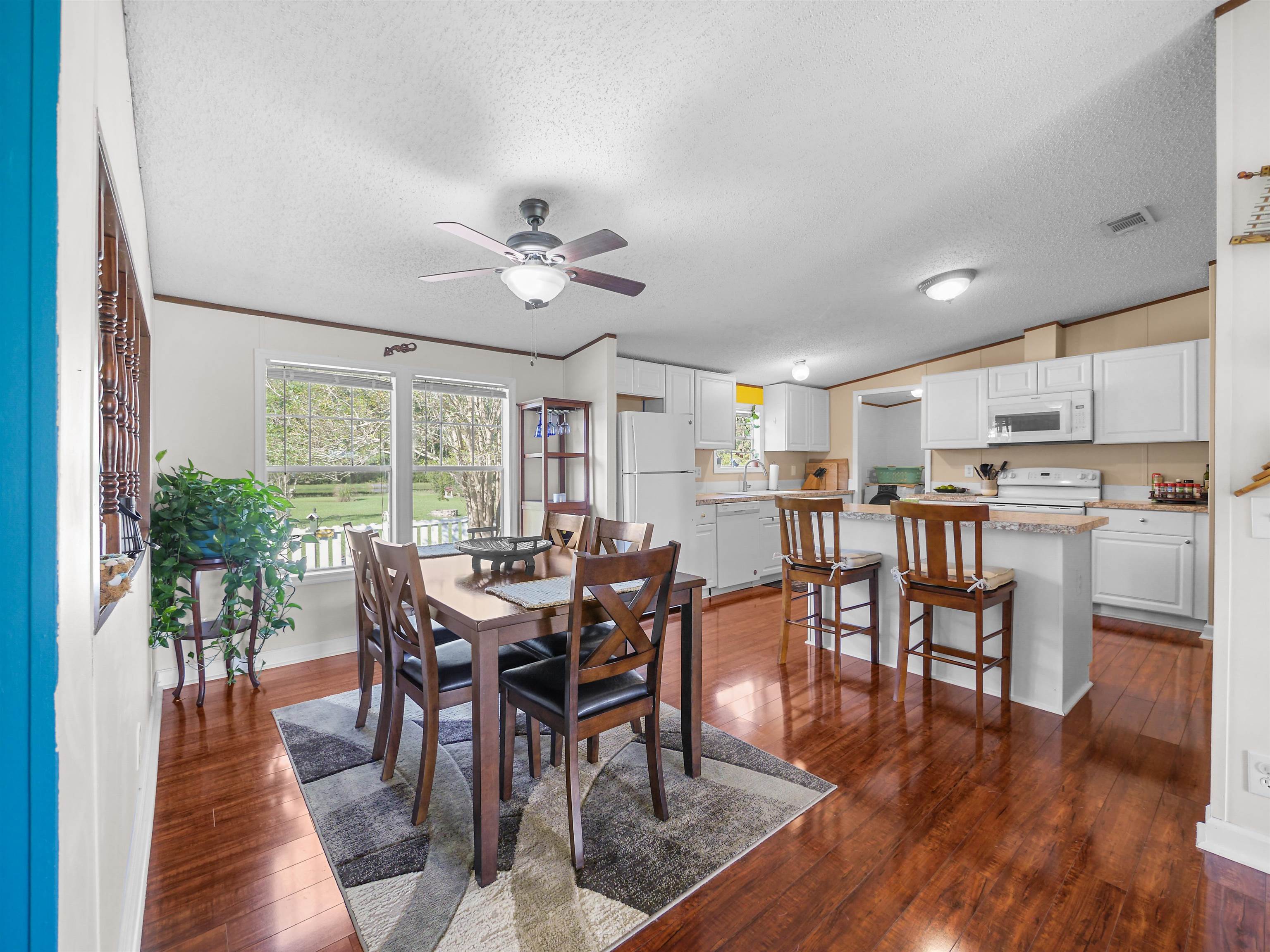 2961 Race Track Road St. Augustine, FL 32084 - Photo 8 of 42 a view of a dining room with furniture window and wooden floor