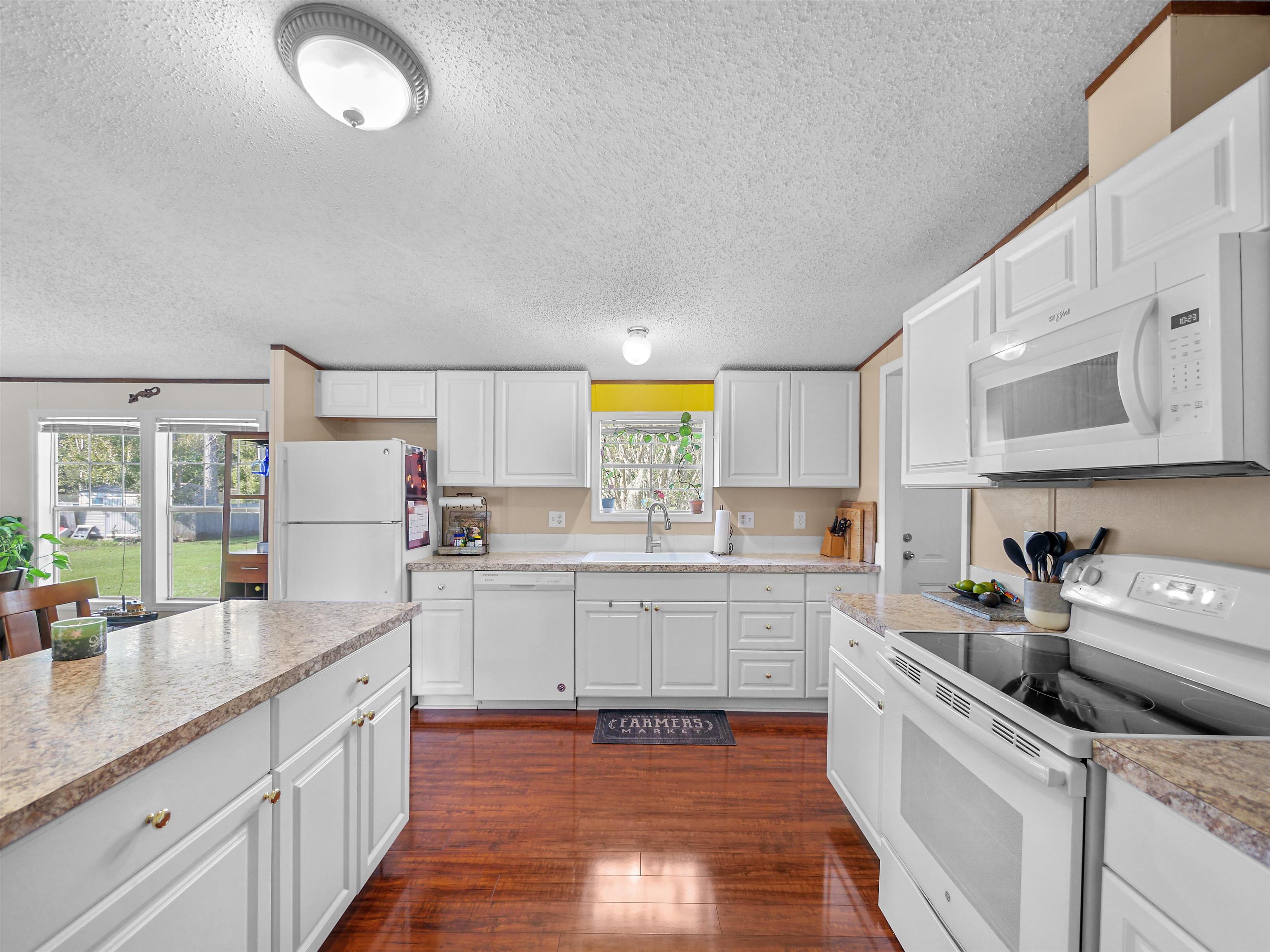 2961 Race Track Road St. Augustine, FL 32084 - Photo 10 of 42 a kitchen with stainless steel appliances granite countertop a sink and cabinets