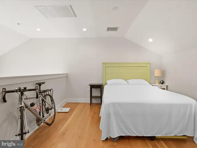 a bedroom with a bed and a table