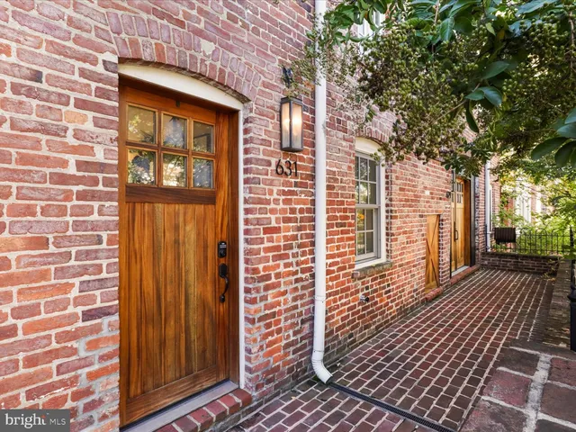 a view of a brick house with wooden floor