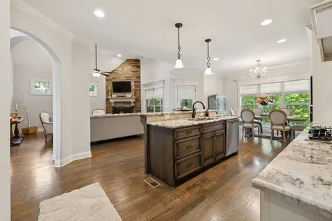 a kitchen with a table and chairs