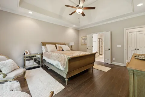 a spacious bathroom with a granite countertop sink mirror and a