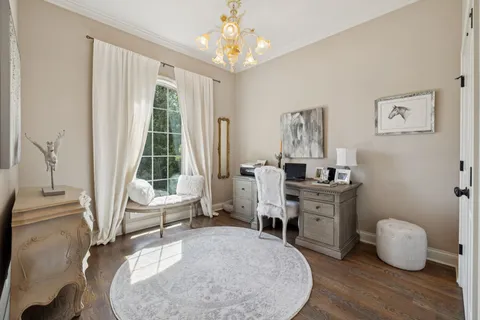 a room with furniture a rug and a window