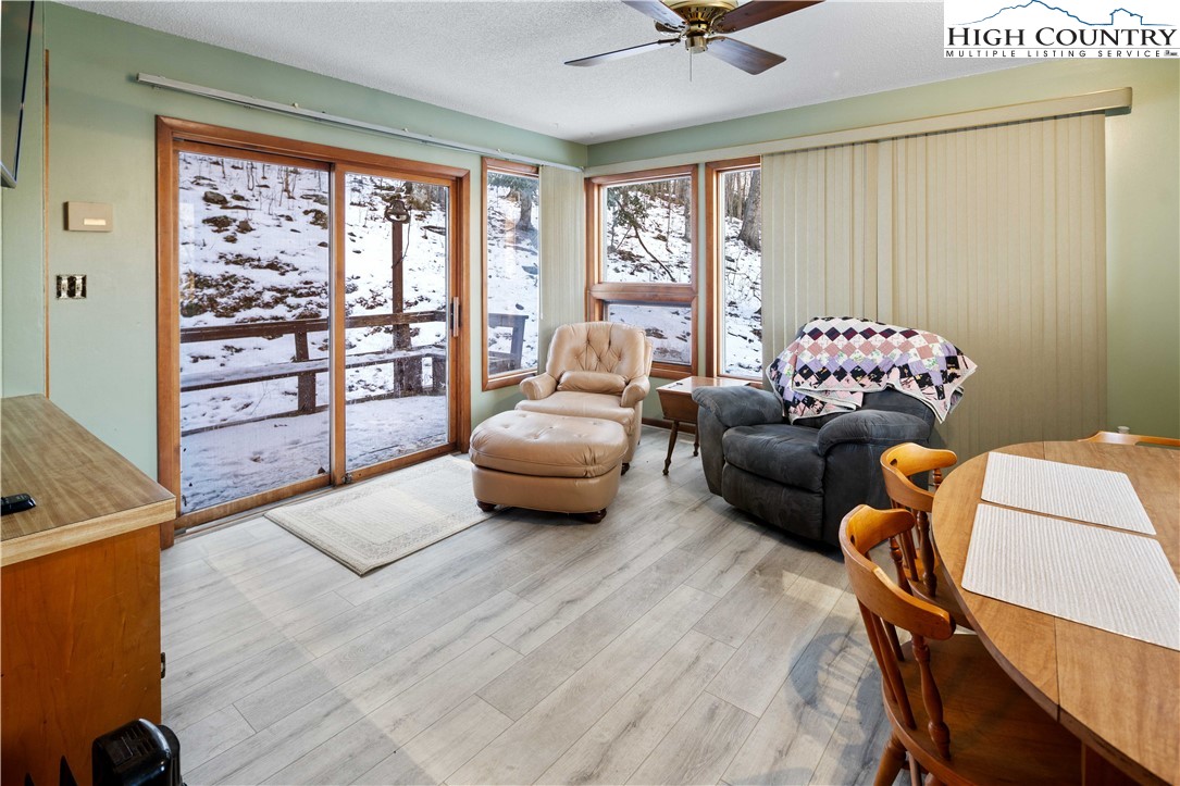 178 Green Knob Mountain Road Boone, NC 28607 - Photo 11 of 49 a living room with furniture and a large window