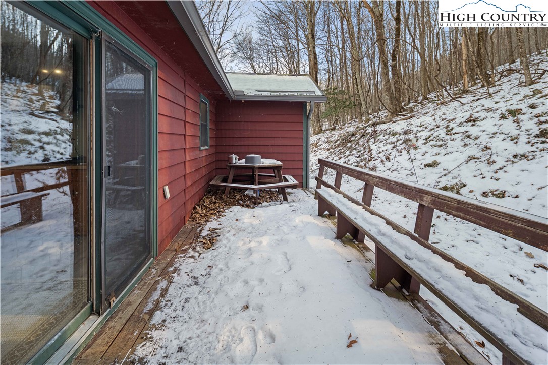 178 Green Knob Mountain Road Boone, NC 28607 - Photo 15 of 49 a view of a pathway of a house with wooden fence