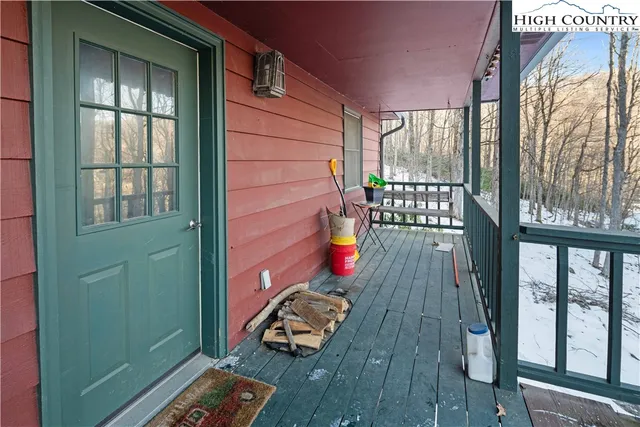 a view of a balcony with wooden floor