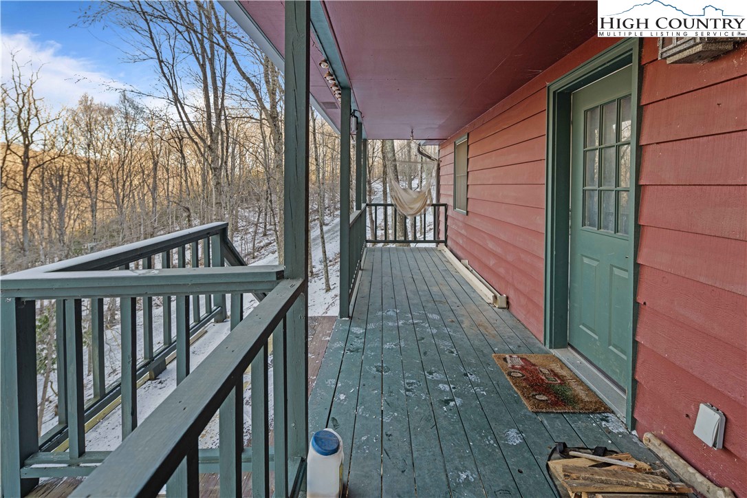 178 Green Knob Mountain Road Boone, NC 28607 - Photo 4 of 49 a view of a balcony with wooden floor