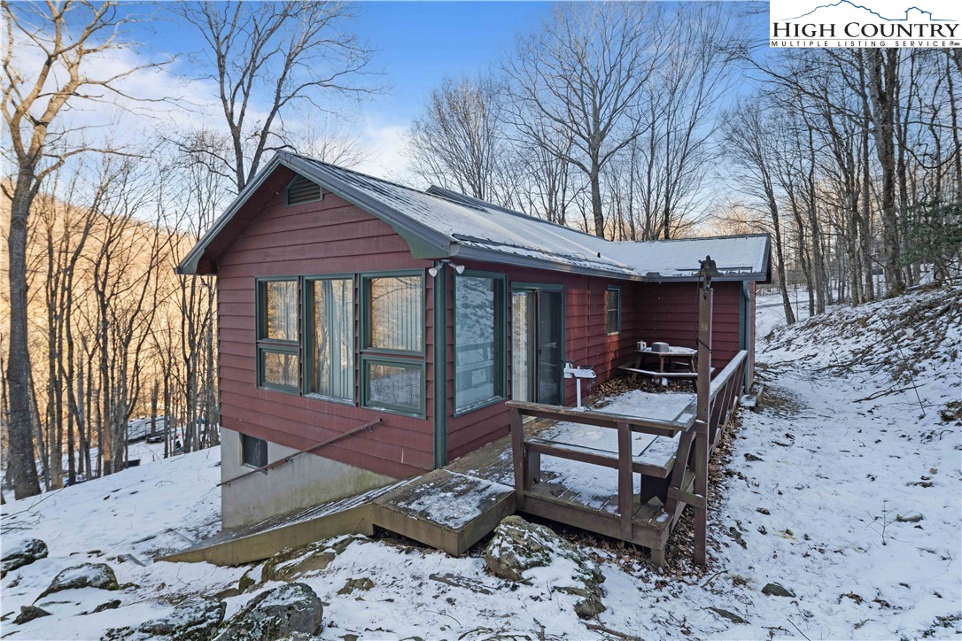 178 Green Knob Mountain Road Boone, NC 28607 - Photo 45 of 49 a view of a house with backyard wooden floor and a barbeque