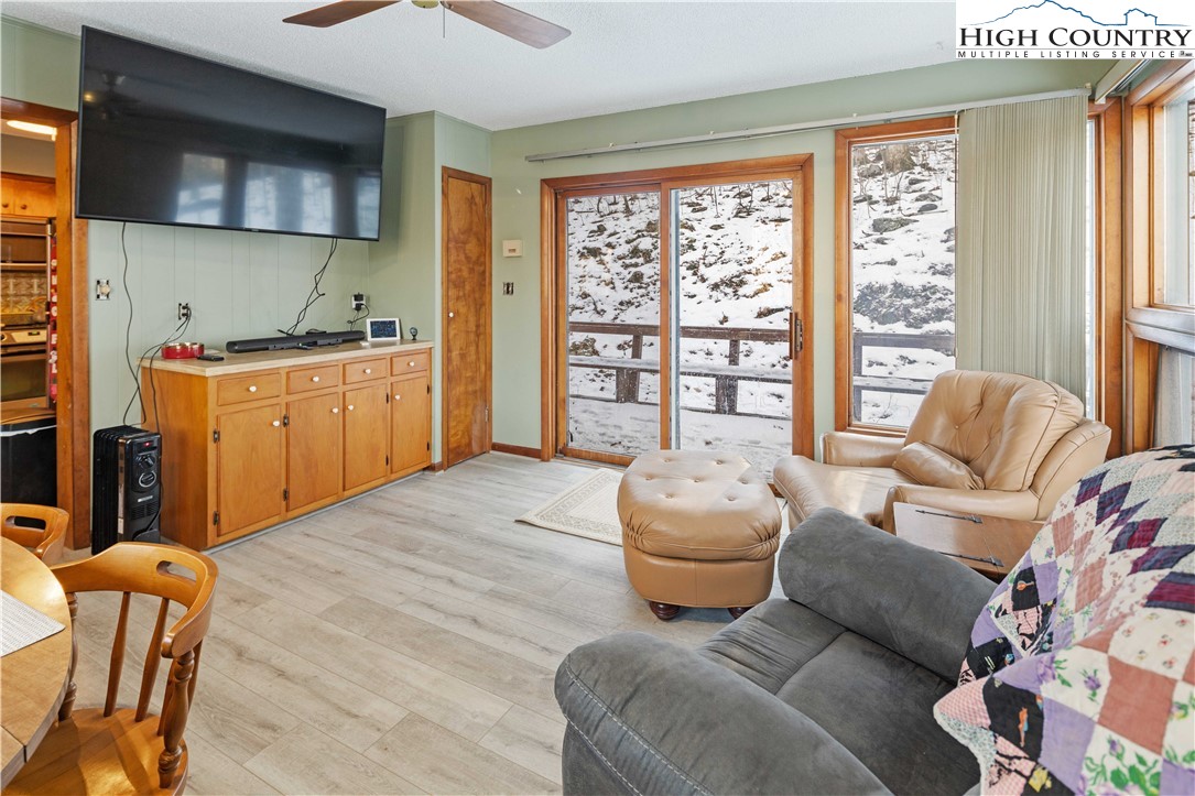 178 Green Knob Mountain Road Boone, NC 28607 - Photo 8 of 49 a bedroom with furniture and a large window