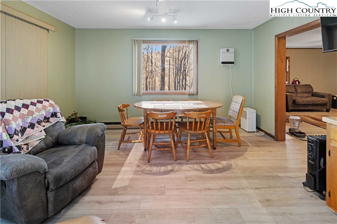 178 Green Knob Mountain Road Boone, NC 28607 - Photo 10 of 49 a dining room with furniture and a window