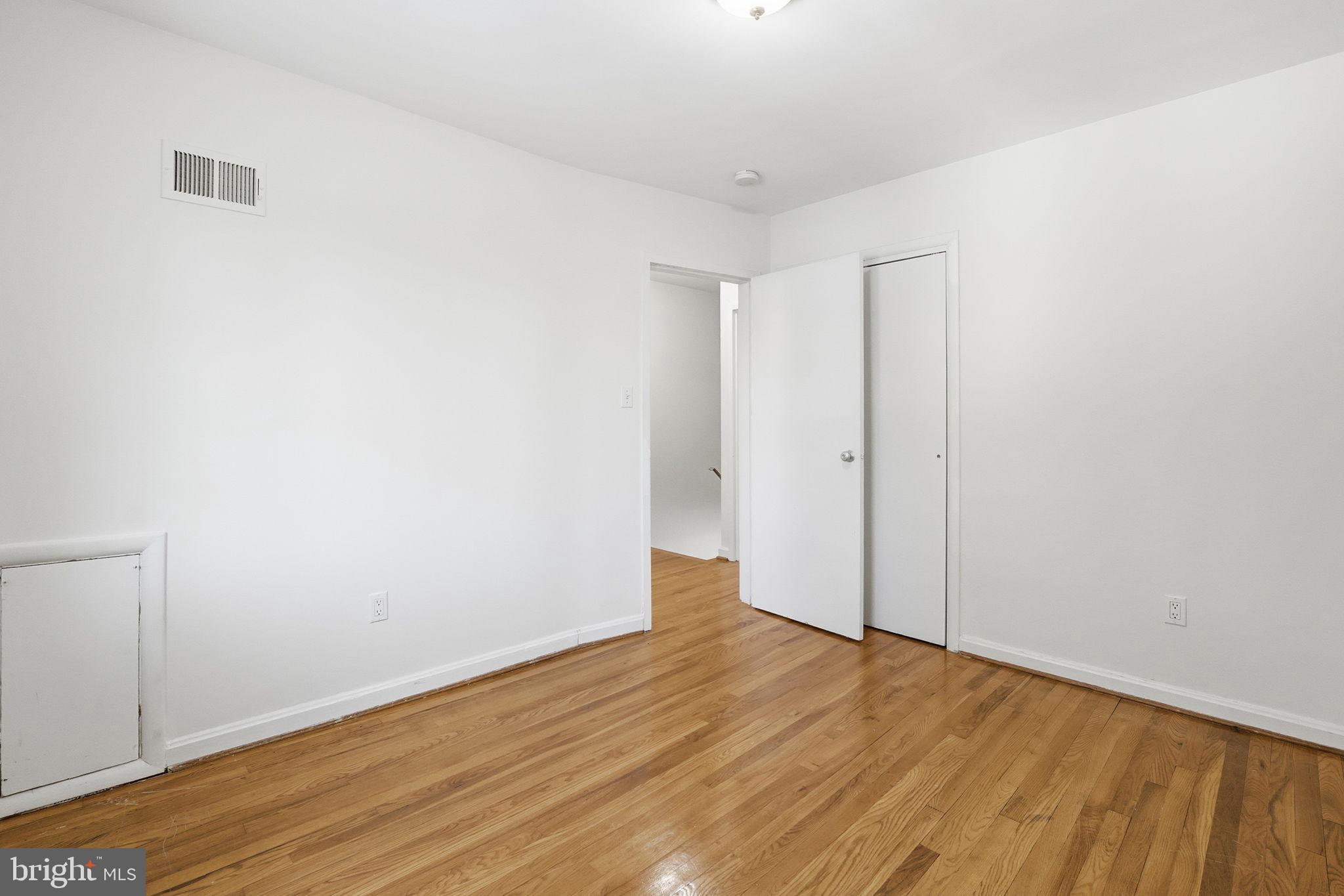 5364 Pooks Hill Road Bethesda, MD 20814 - Photo 14 of 20 a view of an empty room with wooden floor
