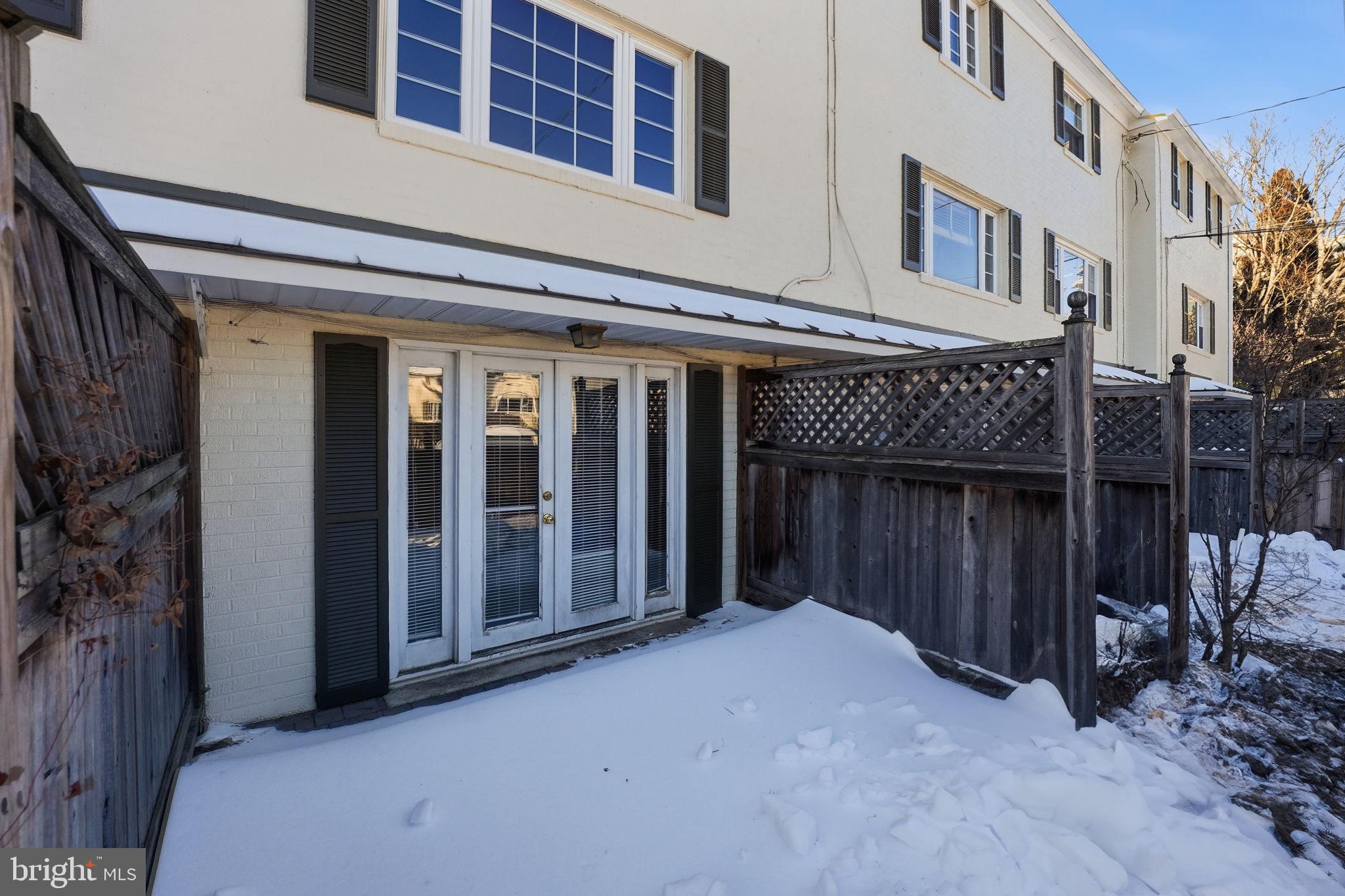 5364 Pooks Hill Road Bethesda, MD 20814 - Photo 20 of 20 a front view of a building with glass door and outdoor space