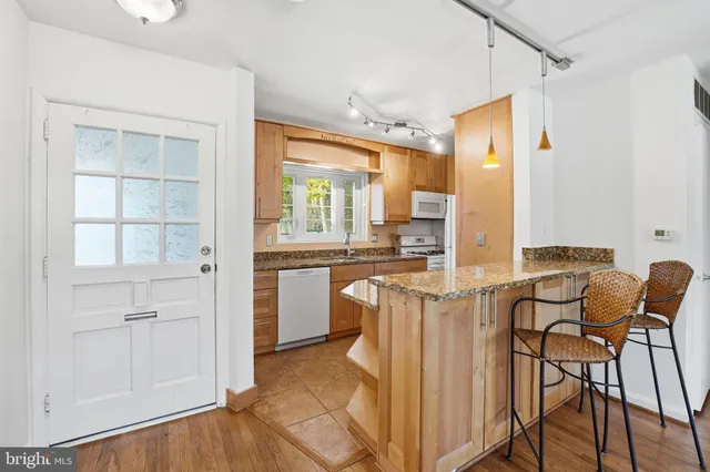 a view of a kitchen cabinets and a counter top space