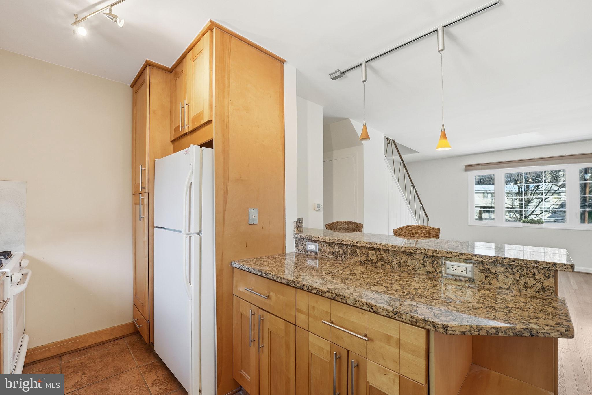 5364 Pooks Hill Road Bethesda, MD 20814 - Photo 8 of 20 a bathroom with a granite countertop sink and a shower