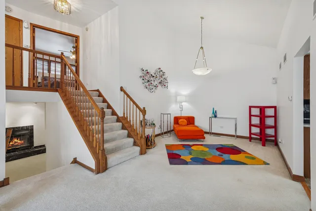 a room with lots of books and white walls