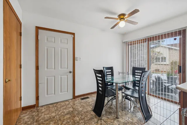 a view of a dining room with furniture and a window