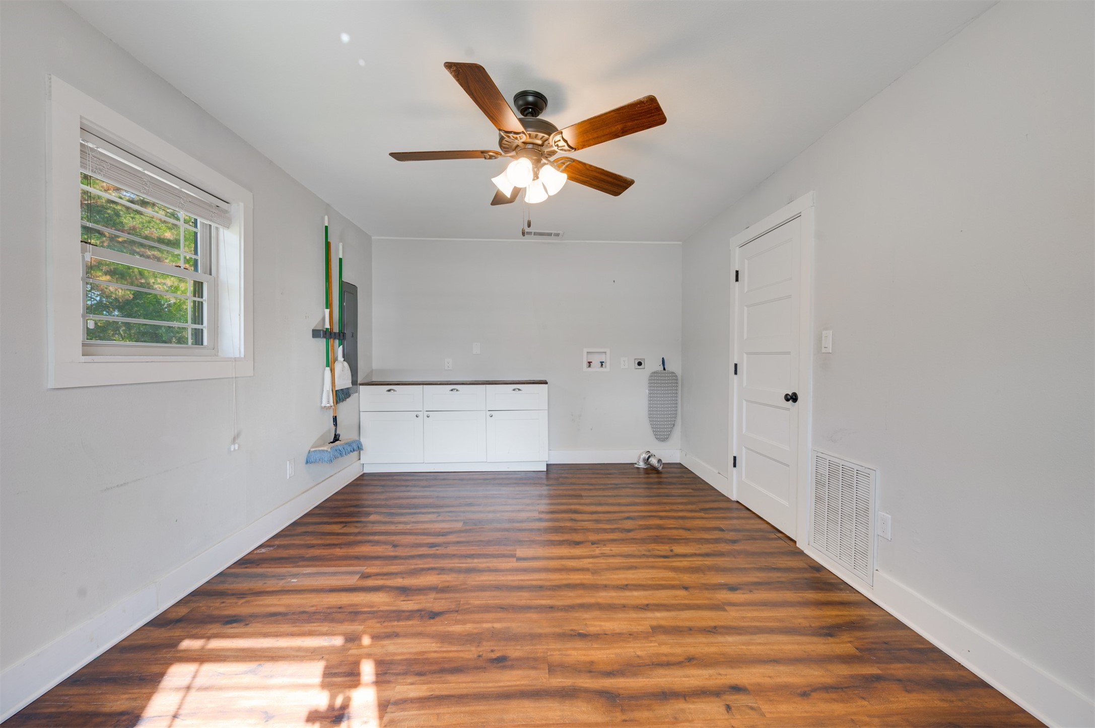 215 Perryman Road Lindale, TX 75771 - Photo 14 of 44 a view of empty room with wooden floor and fan