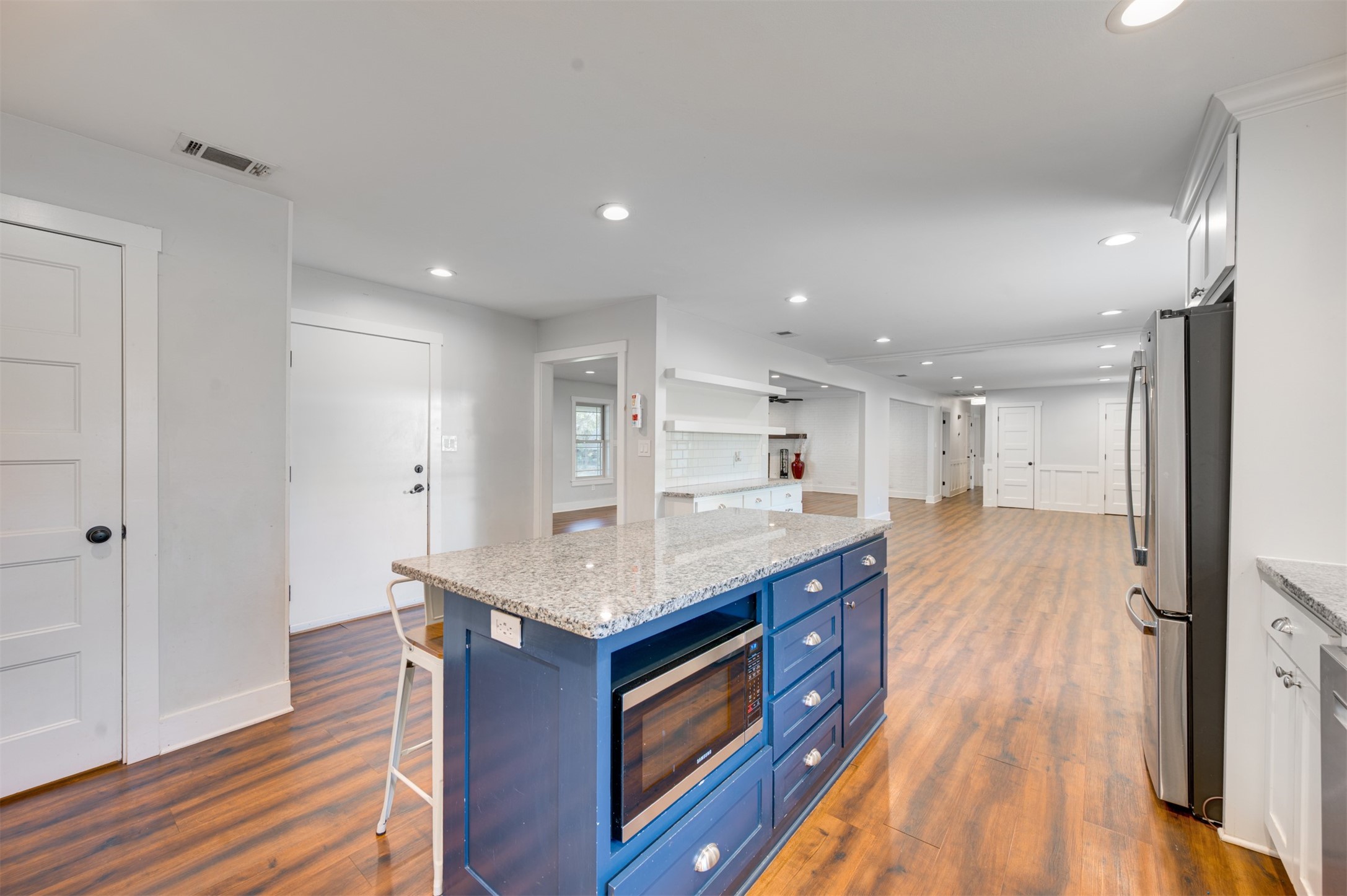 215 Perryman Road Lindale, TX 75771 - Photo 17 of 44 a kitchen with a stove a sink and a refrigerator