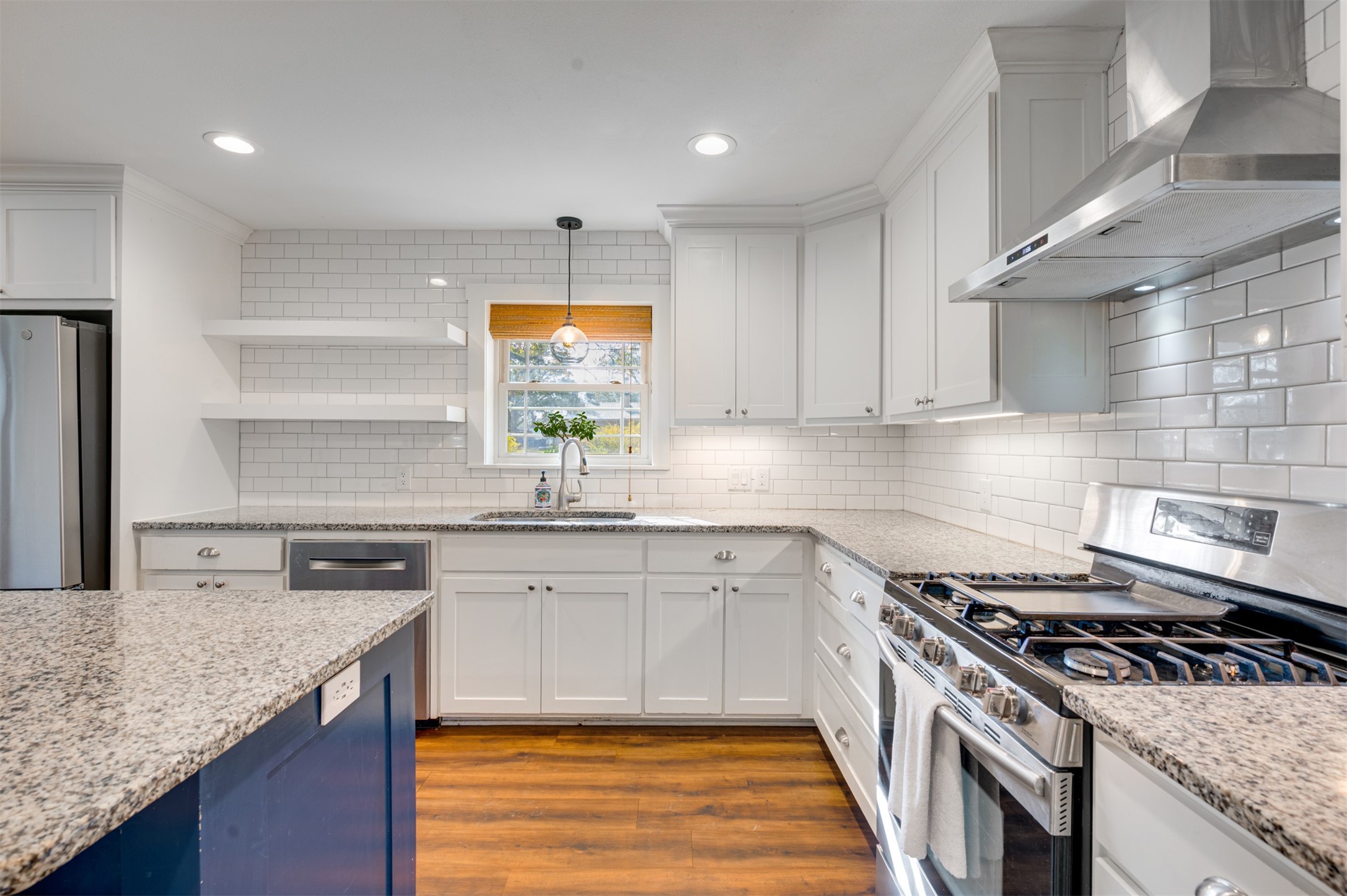 215 Perryman Road Lindale, TX 75771 - Photo 19 of 44 a kitchen with stainless steel appliances granite countertop a sink stove and cabinets