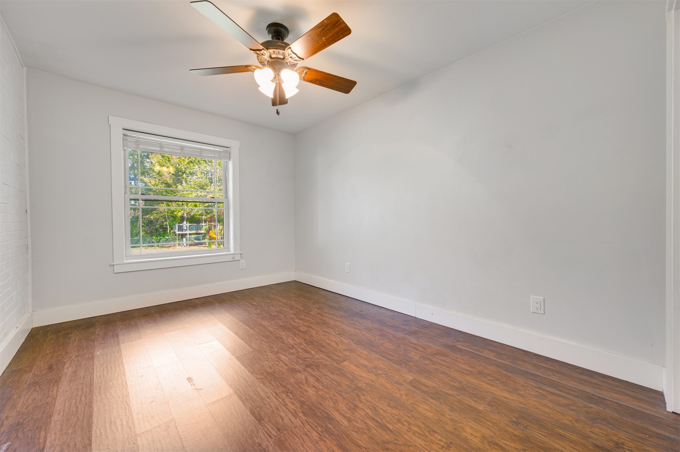 215 Perryman Road Lindale, TX 75771 - Photo 28 of 44 an empty room with wooden floor and windows