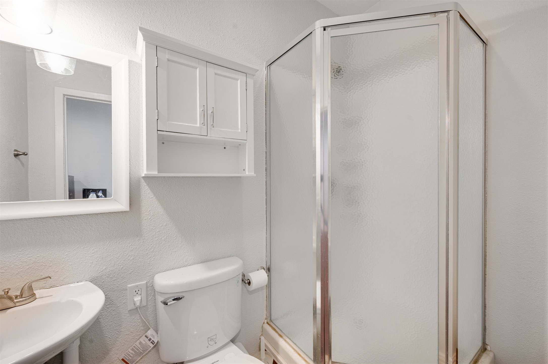 215 Perryman Road Lindale, TX 75771 - Photo 34 of 44 a bathroom with a sink a toilet and shower