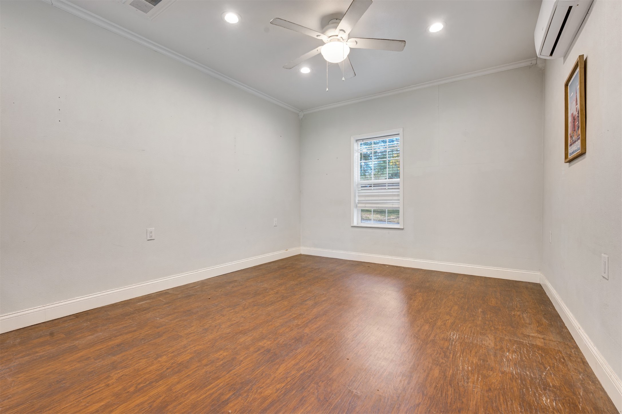 215 Perryman Road Lindale, TX 75771 - Photo 35 of 44 wooden floor in an empty room with a window