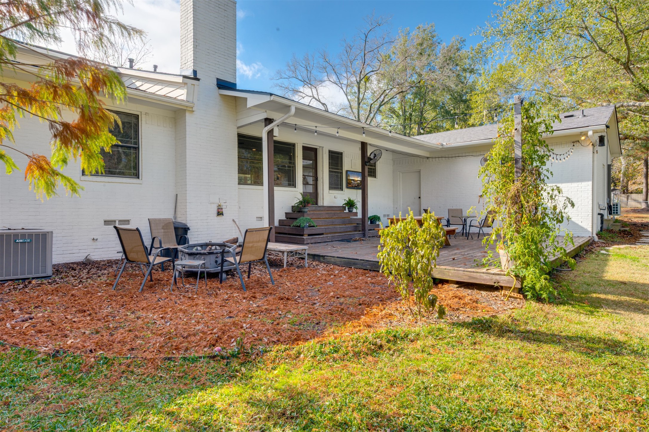 215 Perryman Road Lindale, TX 75771 - Photo 36 of 44 a view of a house with backyard and sitting area