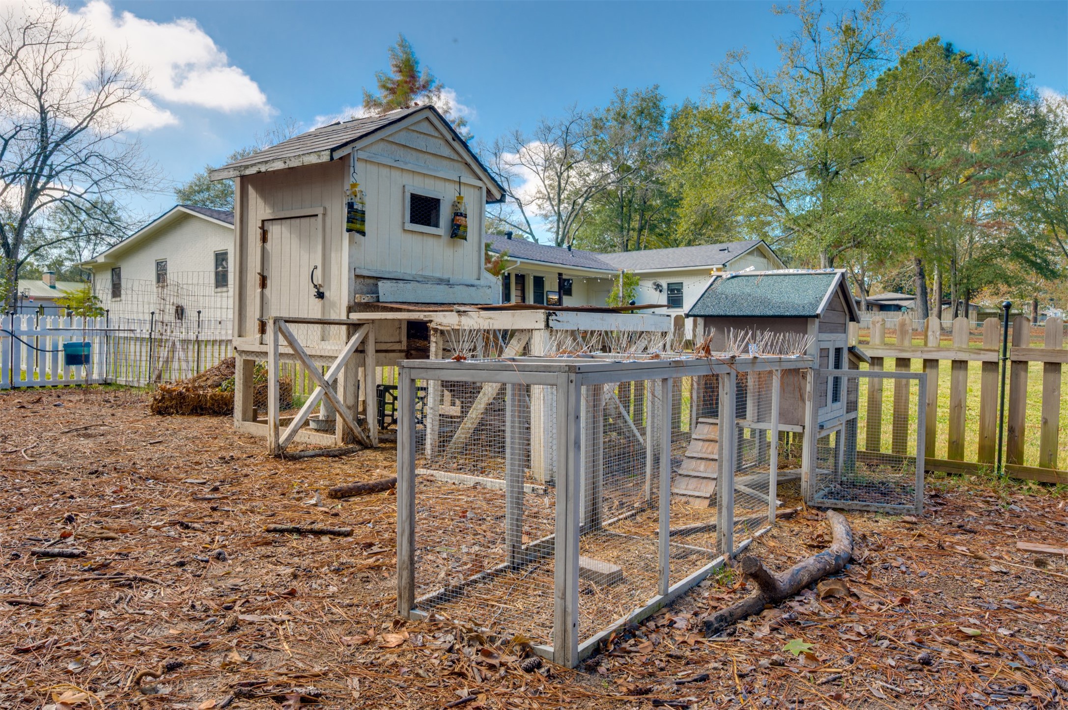 215 Perryman Road Lindale, TX 75771 - Photo 38 of 44 a view of a house with a yard chairs and floor to ceiling window