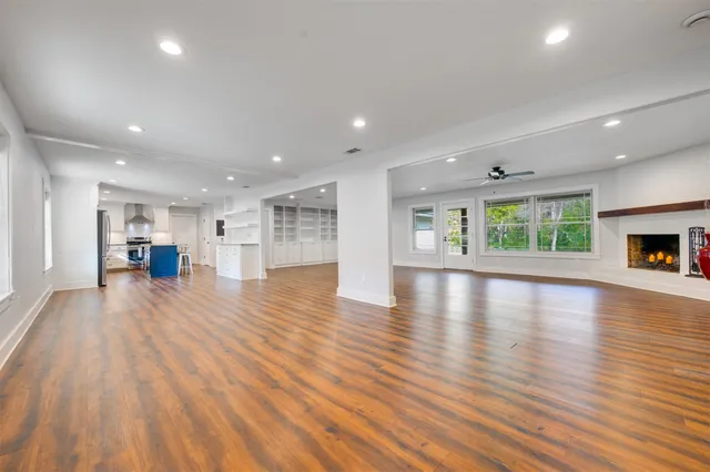 a kitchen with stainless steel appliances granite countertop a sink stove and cabinets
