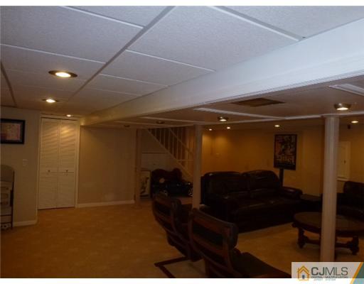 19 Sinclair Road Edison, NJ 08820 - Photo 22 of 25 a living room with furniture and a rug