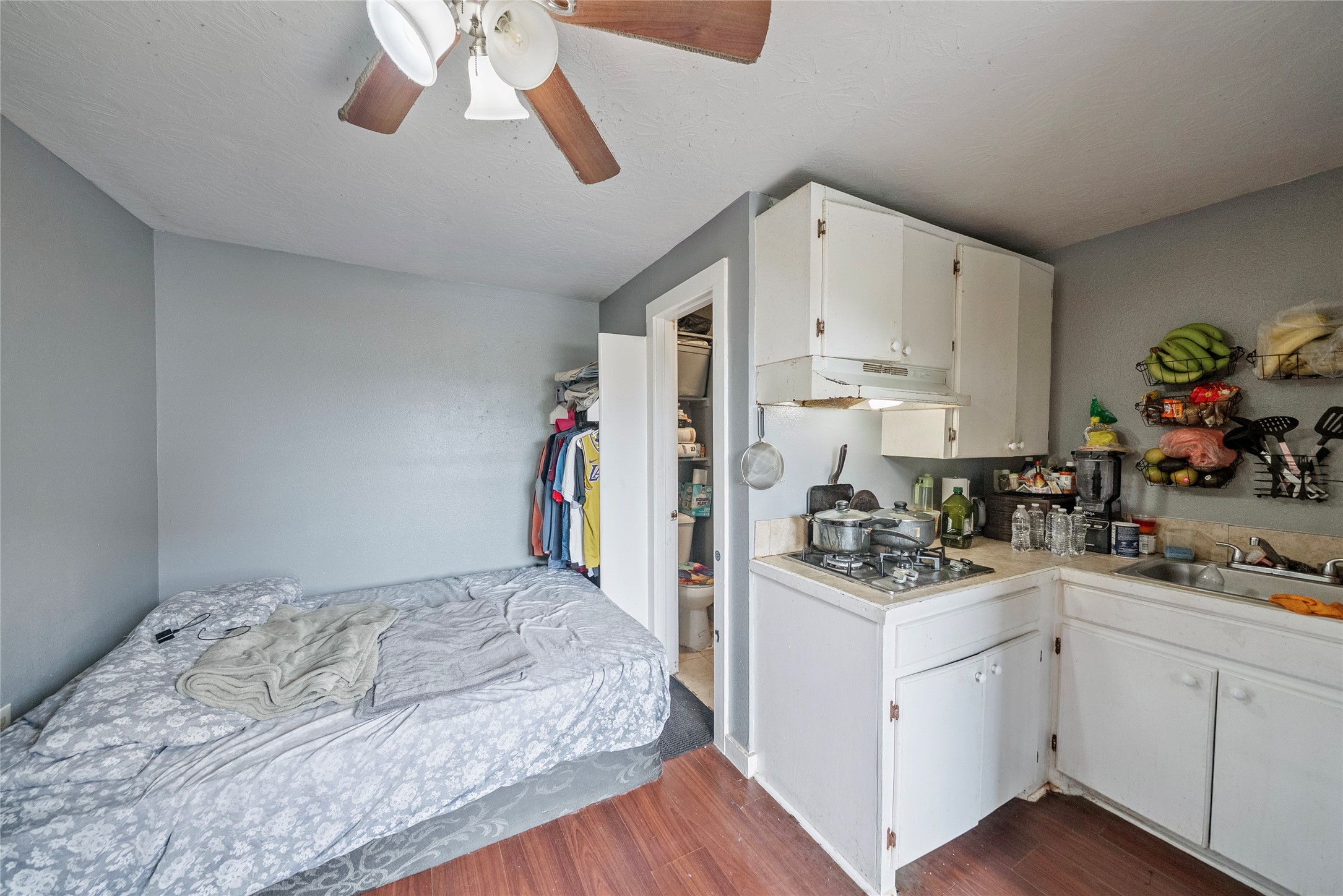 7938 Kerr Street, Unit 6 Houston, TX 77029 - Photo 14 of 18 a kitchen with a sink cabinets and wooden floor
