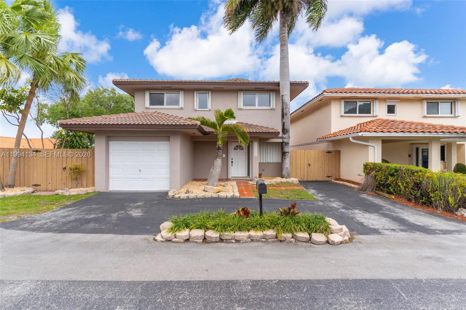 11319 Southwest 73rd Lane Miami, FL 33173 - Photo 1 of 43 front view of a house with a yard