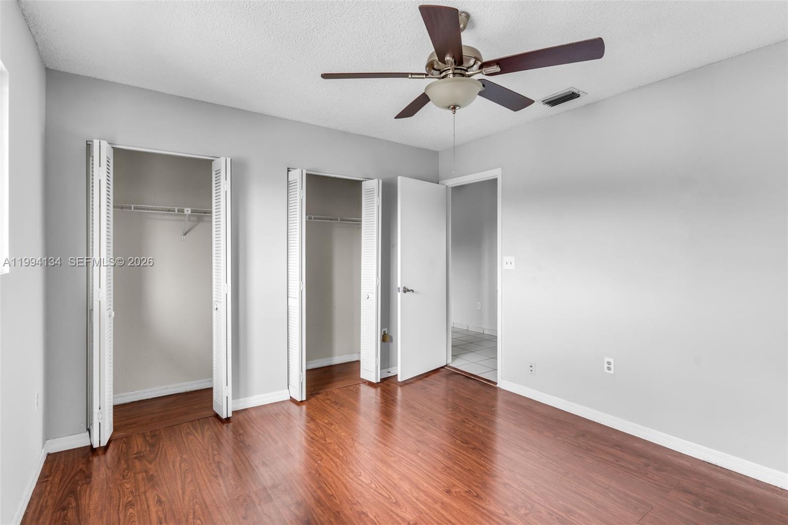 11319 Southwest 73rd Lane Miami, FL 33173 - Photo 20 of 43 a view of an empty room with wooden floor